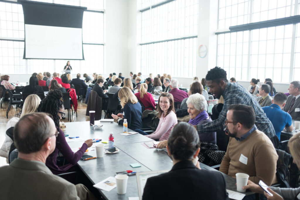 Person speaking at a conference