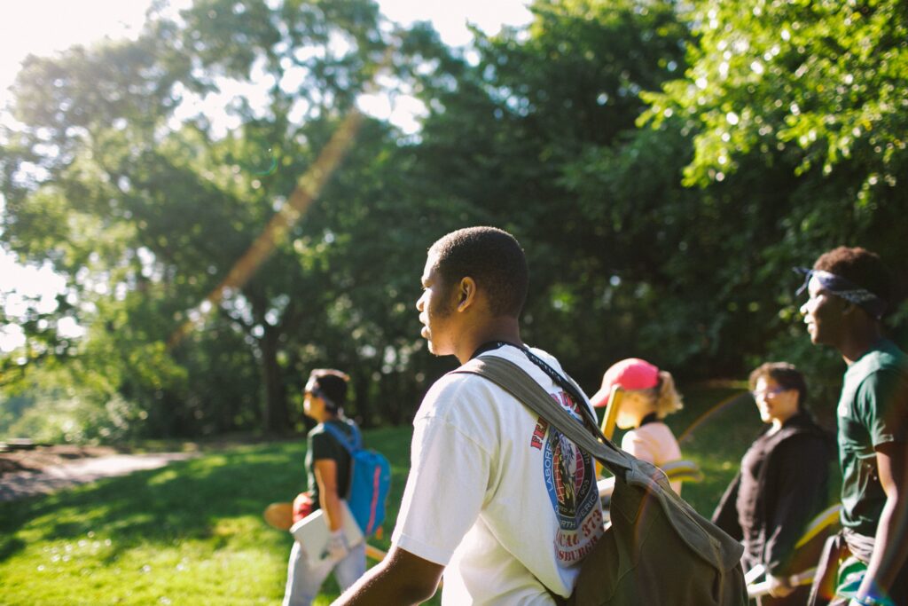 High school conservationists participate in a nature walk through Frick Park.