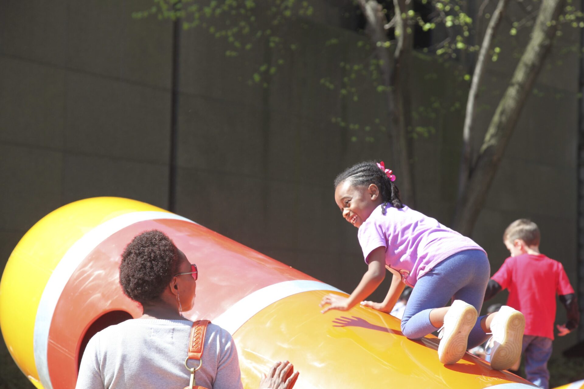 A Mother and Daughter Engaging in Play at the Carnegie Museum of Art Lozziworm; 1st Annual Ultimate Play Day