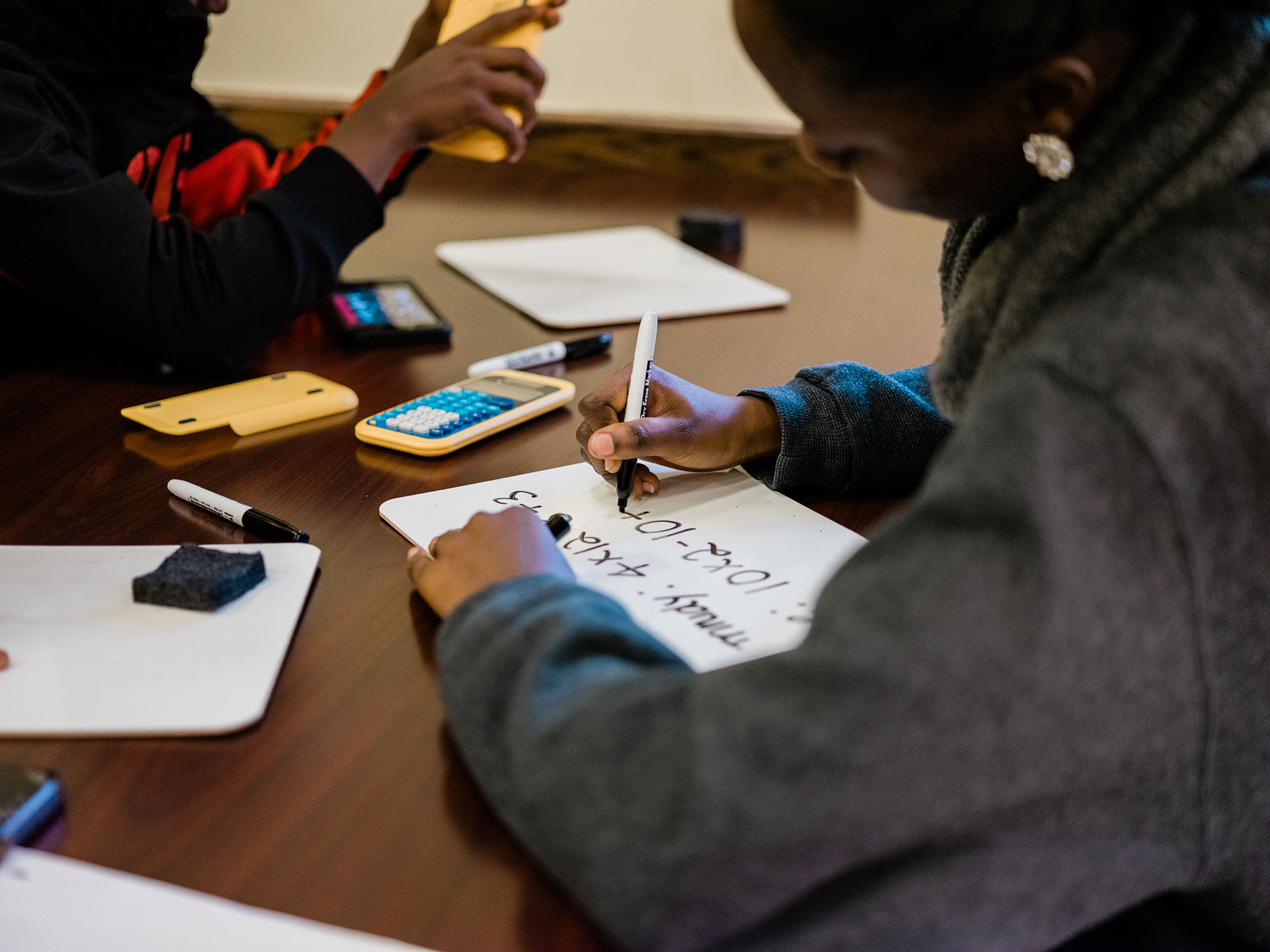 Students at PPS UPrep Milliones work out math equations during Ready to Learn / Photo by Ben Filio