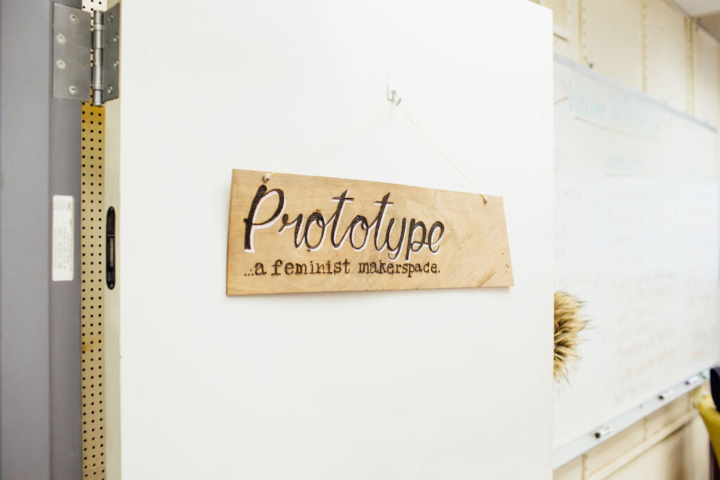 A hand made sign that reads — Prototype ... a feminist makerspace.